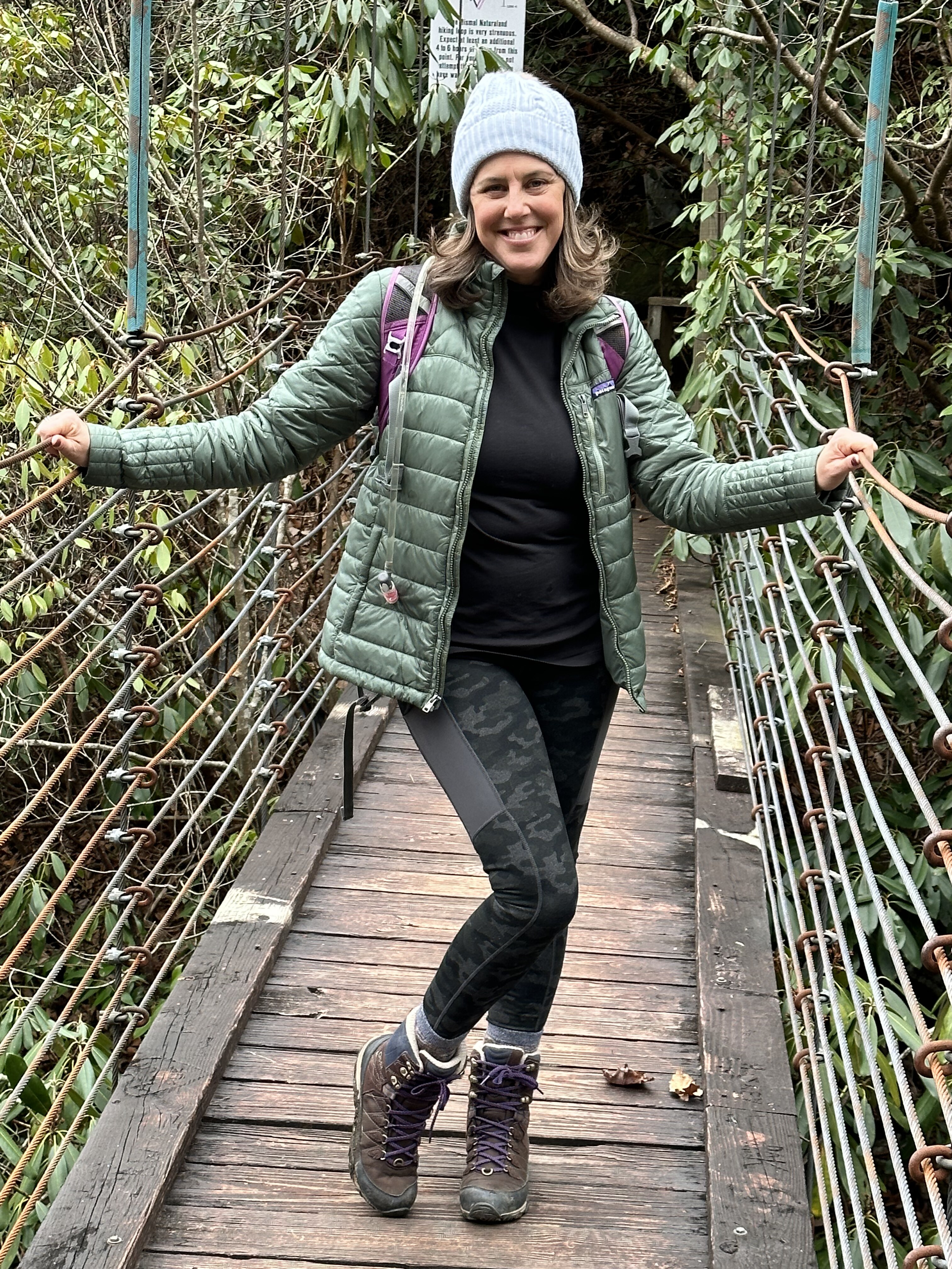 Victoria on a Blue Ridge footbridge mid-hike